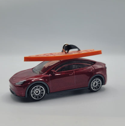 Tesla Model Y Red Diecast Christmas Ornament with Surfboard on Roof – Color of Surfboard May Vary – Perfect Holiday Decoration for Car Enthusiasts
