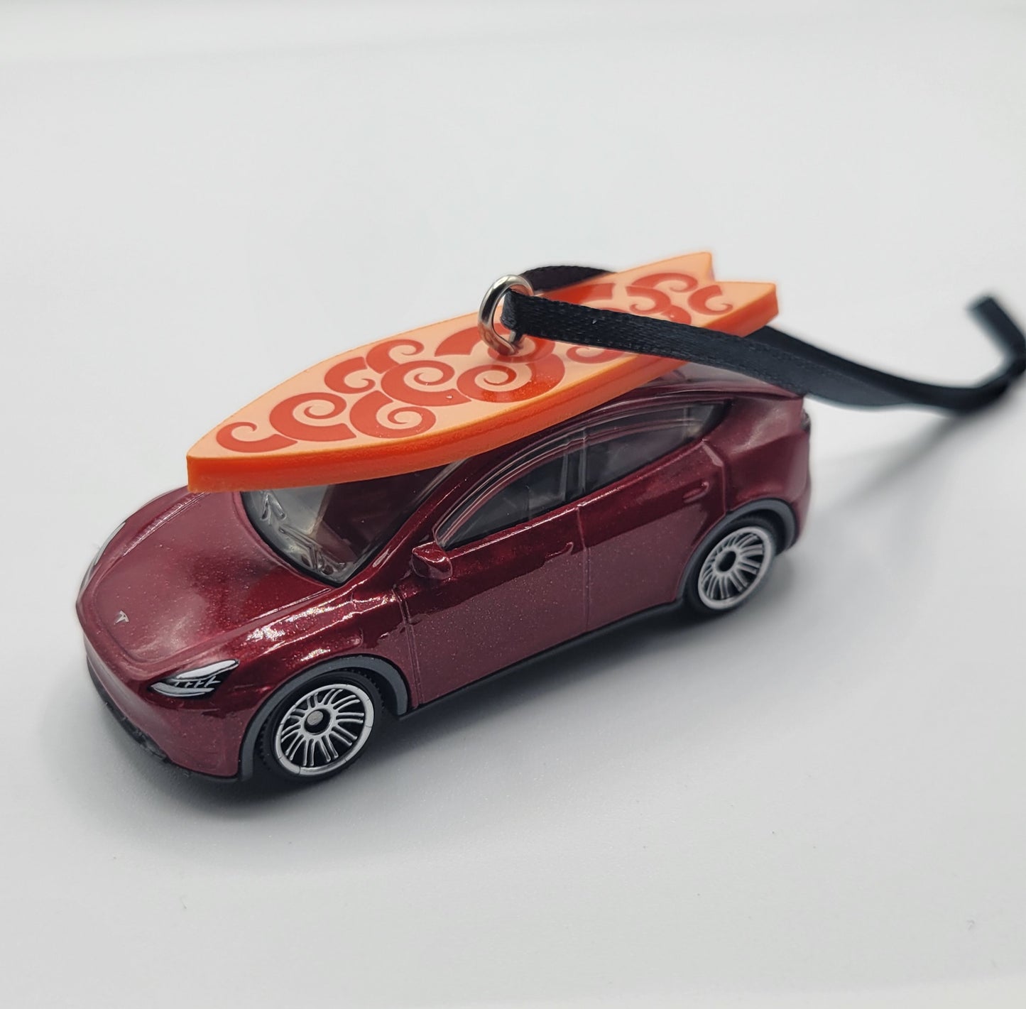 Tesla Model Y Red Diecast Christmas Ornament with Surfboard on Roof – Color of Surfboard May Vary – Perfect Holiday Decoration for Car Enthusiasts