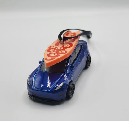 Tesla Model Y Blue Diecast Christmas Ornament with Surfboard on Roof – Color of Surfboard May Vary – Perfect Holiday Decoration for Car Enthusiasts