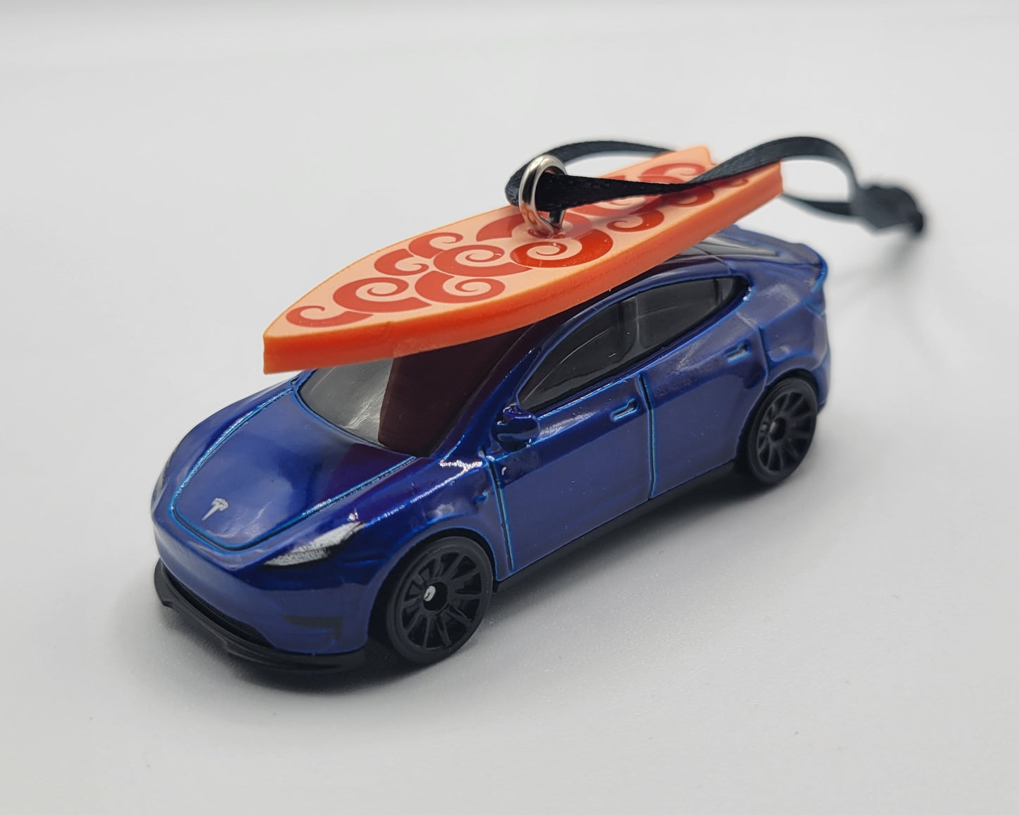Tesla Model Y Blue Diecast Christmas Ornament with Surfboard on Roof – Color of Surfboard May Vary – Perfect Holiday Decoration for Car Enthusiasts